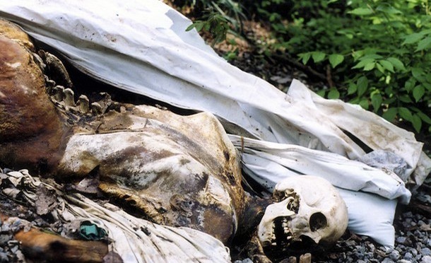 Handout photo shows a corpse lying on the ground at the University of Tennesse's Forensic Anthropology Research Facility, also known as the "Body Farm"
